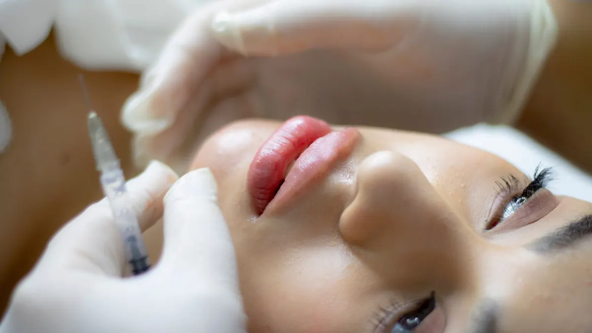 Client undergoing a personalized skin consultation at a Roseville medical aesthetic studio