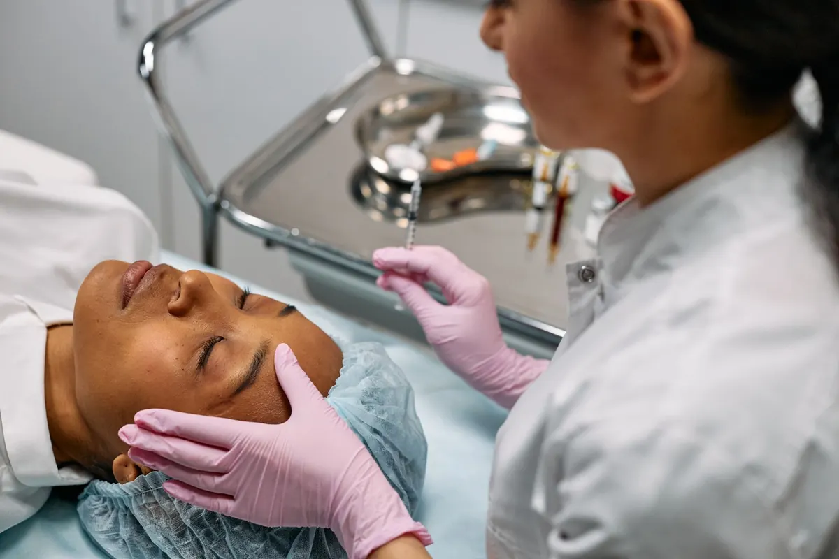 Close-up view of a client undergoing biostimulatory facial rejuvenation in a Roseville aesthetic studio